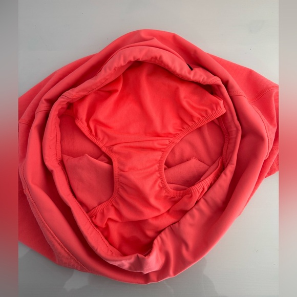 Oiselle Women's Roga Shorts in bright coral - Picture 3 of 5